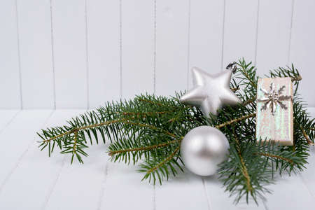 Christmas decoration with fir branches on white striped background - selective focus, copy spaceの写真素材