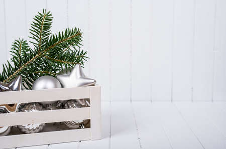 Christmas decoration with fir branches on white striped background - selective focus, copy spaceの写真素材