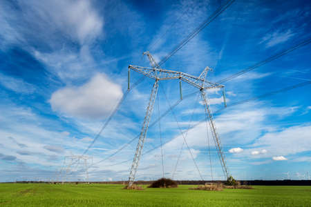 High voltage electric pillar against blue sky