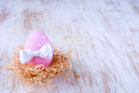 Easter eggs over white wooden vintage table - copy space