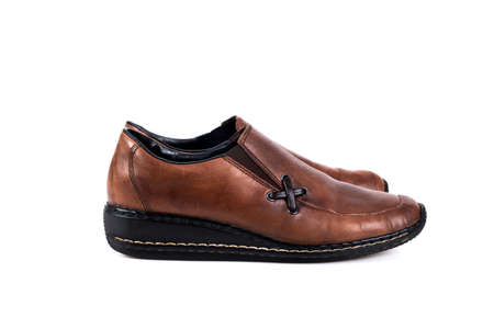 Brown women's casual shoes on a white backgroundの写真素材
