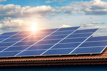 Solar panel on a red roof 