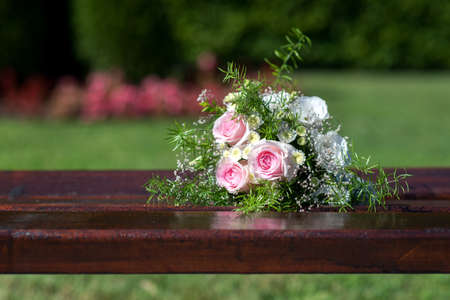bridal bouquet on a wooden bench - selective focus, copy spaceの写真素材