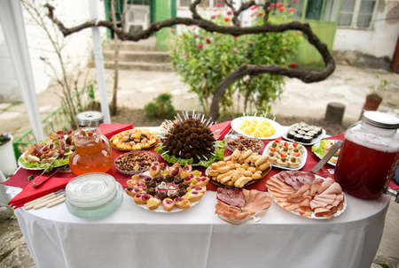 table set for a garden party - catering, drinks and decoration - selective focus