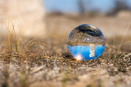 Upside down landscape of Pobiti Kamani, The Stone Forest Natural Reserve near Varna in Bulgaria, Eastern Europe - reflection in a lens ball - selective focus, space for textの写真素材