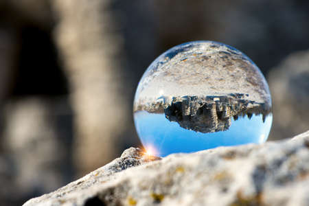 Upside down landscape of Pobiti Kamani, The Stone Forest Natural Reserve near Varna in Bulgaria, Eastern Europe - reflection in a lens ball - selective focus, space for textの写真素材
