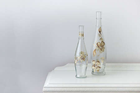 painted glass bottle over an antique wooden cabinet - home decoration - selective focus, copy spaceの写真素材
