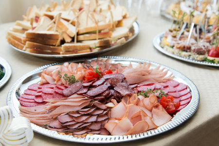 The buffet at the reception. Assortment of canapes. Banquet service. Catering, snacks with different types of cheese and meat. Party Concept.の写真素材