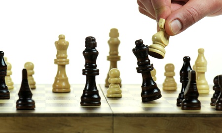 Chess board with chess pieces on white backgroundの写真素材