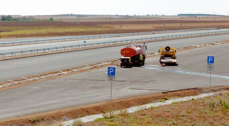 Support activities for the construction of a highway  Road under construction のeditorial素材