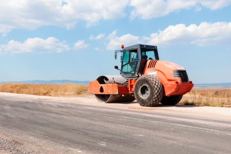 Support activities for the construction of a highway  Road under construction の写真素材