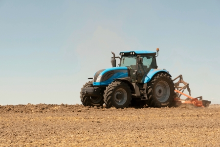Agricultural activities, modern farm equipment in fieldの写真素材