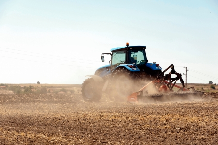 Agricultural activities, modern farm equipment in fieldのeditorial素材