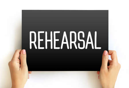 Rehearsal - practice or trial performance of a play or other work for later public performance, text concept on cardの写真素材