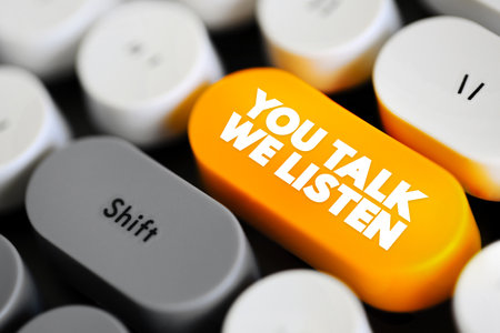 You Talk, We Listen emphasizes a commitment to active listening and valuing what others have to say, text button on keyboardの写真素材