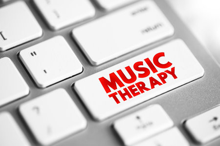 Music Therapy is the clinical and evidence-based use of music interventions to accomplish individualized goals within a therapeutic relationship, text concept button on keyboardの写真素材