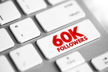 60K Followers - reaching 60,000 followers on a social media platform or other online platform, text concept button on keyboardの写真素材