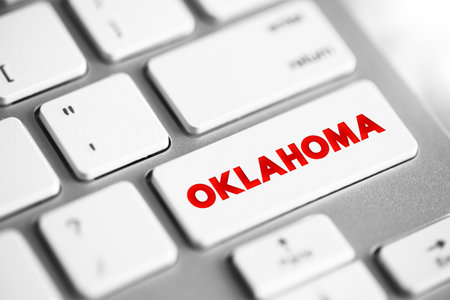 Oklahoma - is a landlocked state in the South Central region of the United States, text concept button on keyboardの写真素材