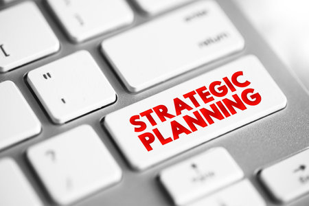 Strategic Planning - organization's process of defining its strategy and making decisions on allocating its resources to attain strategic goals, text concept button on keyboardの写真素材