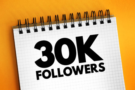 30K Followers - reaching 30,000 followers on a social media platform or other online platform, text concept on notepadの写真素材