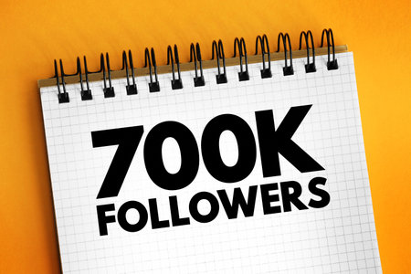 700K Followers - reaching 700,000 followers on a social media platform or other online platform, text concept on notepadの写真素材