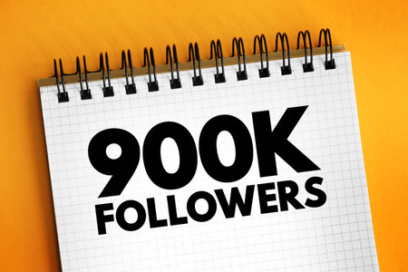 900K Followers - reaching 900,000 followers on a social media platform or other online platform, text concept on notepadの写真素材