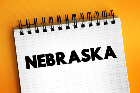 Nebraska - is a triply landlocked state in the Midwestern region of the United States, text concept on notepadの写真素材
