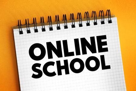 Online School - teaches students entirely or primarily online or through the Internet, text concept on notepadの写真素材