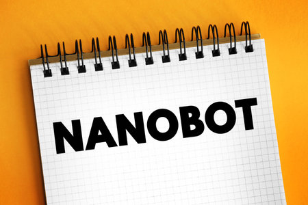 Nanobot - are robot that carry out a very specific function and are ~50â100 nm wide, text stamp concept on notepadの写真素材