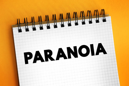 Paranoia - instinct or thought process that is believed to be heavily influenced by anxiety or fear, text concept on notepadの写真素材
