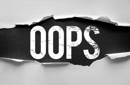 The word OOPS in bold, distressed white letters is dramatically revealed beneath torn paper on a...