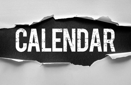 Word CALENDAR in bold distressed letters revealed behind torn paper edges. Concept design for planning, schedule, deadlines, appointments, events, organization, or time management visualsの写真素材