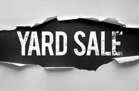 Bold distressed "YARD SALE" text revealed through torn paper layers. Creative and eye-catching design concept perfect for announcing community sales, secondhand events, or garage clearancesの写真素材