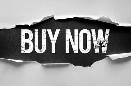 Distressed âBUY NOWâ text revealed through a torn paper background with a bold, textured design. Perfect for e-commerce, advertising, marketing, promotions, and urgent call-to-action visualsの写真素材