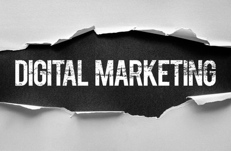 Grunge-style âDIGITAL MARKETINGâ text revealed through torn paper, representing online promotion, e-commerce strategy, SEO, and business growth. Ideal for modern marketing visuals and contentの写真素材