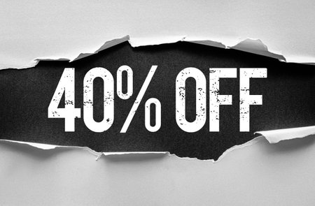 Bold distressed "40% OFF" text revealed through torn paper layers. Eye-catching discount banner or promotion graphic concept perfect for advertising, marketing, sales, or retail campaignsの写真素材