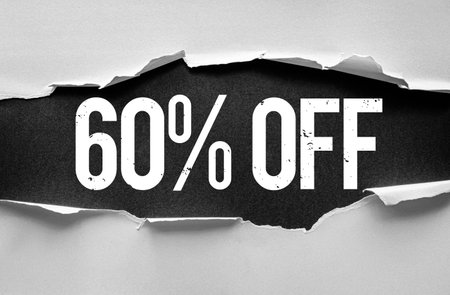 Bold distressed "60% OFF" text revealed through torn paper layers. Eye-catching discount banner or promotion graphic concept perfect for advertising, marketing, sales, or retail campaignsの写真素材