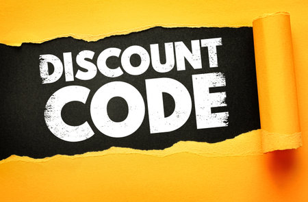 Bold white text reading "DISCOUNT CODE" revealed through torn yellow paper on a black background, creating a dynamic promotional image perfect for sales, marketing, and e-commerce campaignsの写真素材