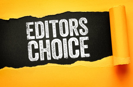 EDITORS CHOICE in bold, distressed white letters revealed through torn yellow paper on a black background. Ideal for promotional, publishing, recommendation, or media spotlight conceptsの写真素材