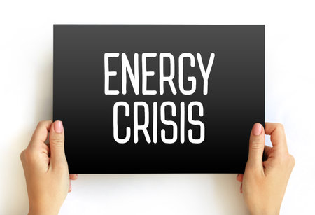 Energy Crisis means a serious shortage of energy resources like oil, gas, or electricity, causing economic and social problems, text concept on cardの写真素材