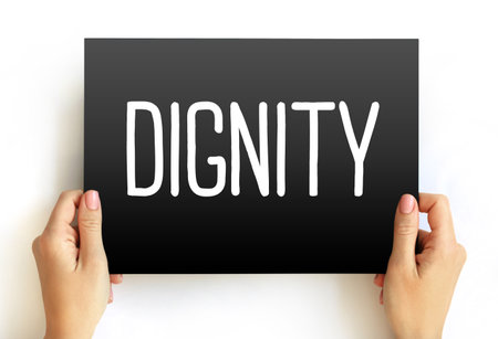 Dignity is the right of a person to be valued and respected for their own sake, and to be treated ethically, text concept on cardの写真素材