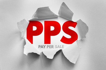 PPS (Pay Per Sale) acronym revealed behind torn paper, symbolizing performance-based digital...