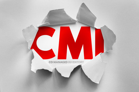 CMI (Co-Managed Inventory) acronym exposed beneath torn paper. Represents collaborative inventory management, supply chain efficiency, vendor partnerships, and streamlined stock control methodsの写真素材