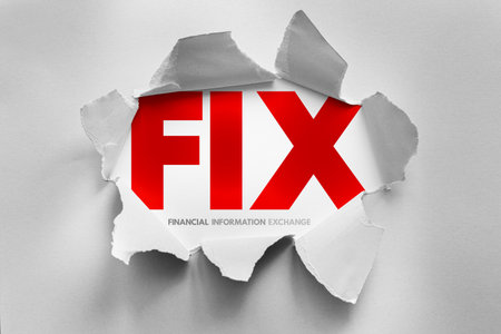 FIX acronym for Financial Information Exchange revealed through torn paper. Represents electronic trading, financial messaging, trading protocols, and securities communicationの写真素材