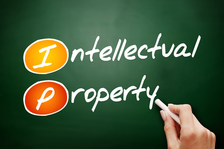 Hand drawn IP - Intellectual Property, business concept on blackboardの写真素材