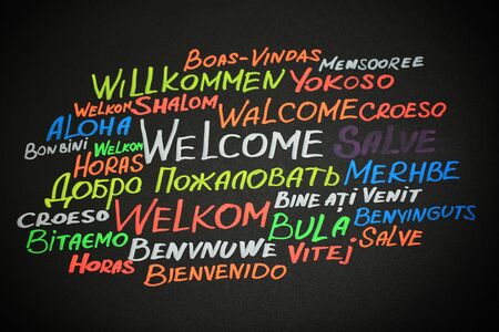 WELCOME word cloud in different languages on blackboardの写真素材