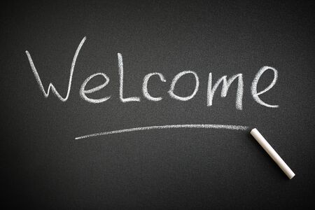 Welcome word on a blackboard. Greeting conceptの写真素材