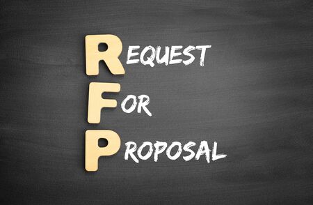 Wooden alphabets building the word RFP - Request For Proposal acronym on blackboardの写真素材