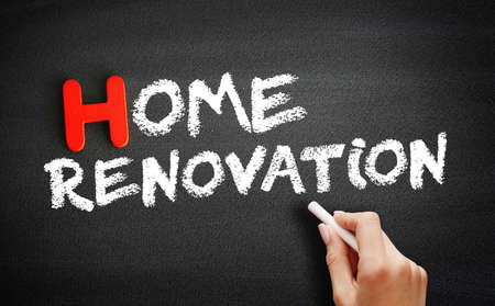 Hand writing Home renovation on blackboard, concept backgroundの写真素材