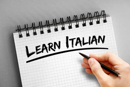 Learn Italian text on notepad, concept backgroundの写真素材